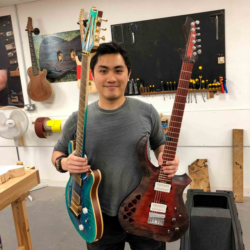 Student with Guitars Built on the 3 Month Course